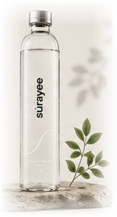 Surayee 1.5L glass bottle on a stone with leaves